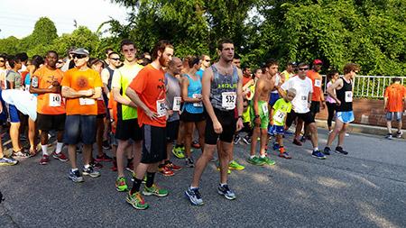 Runners gather at the starting line of the Miles That Matter Pikesville 5K on July 12. The race, which marked its 15th year, raises money for the Ulman Cancer Fund.