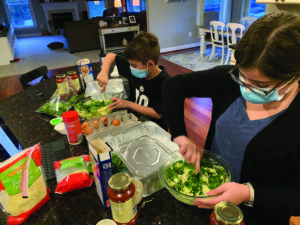 students Ari and Abby Gelman cook