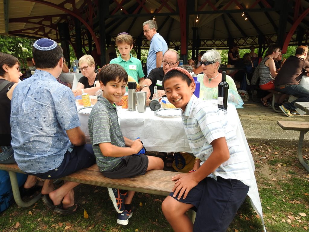 Attendees participate in a 2019 Services in the Park event.