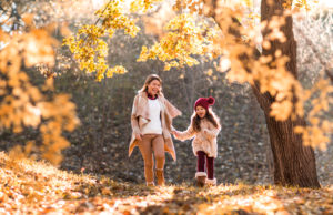 Mom and daughter in fall foliage