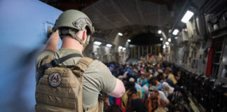 U.S. Air Force security forces raven, assigned to the 816th Expeditionary Airlift Squadron, maintains security aboard a U.S. Air Force C-17 Globemaster III aircraft in support of the Afghanistan evacuation at Hamid Karzai International Airport (HKIA), Afghanistan, Aug. 24, 2021