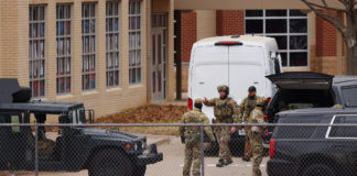 SWAT team members deploy near the Congregation Beth Israel Synagogue in Colleyville, Texas
