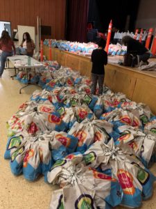 JVC volunteers assemble care packages on Mitzvah Day at the Park Heights JCC