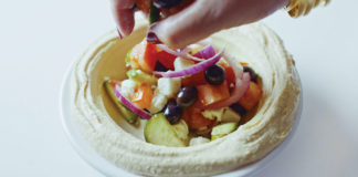 hummus topped with Greek salad