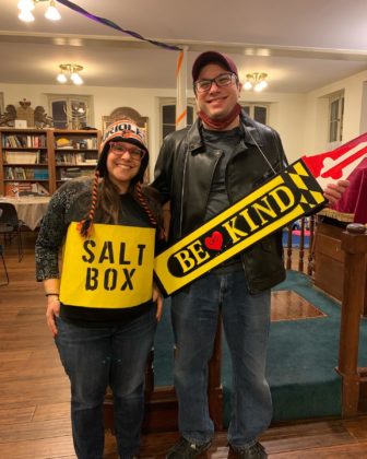 Nadine Simpson and Scott Stofenberg, dressed as a salt box and a Be Kind sign, respectively