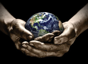 Stock image of hands holding the earth