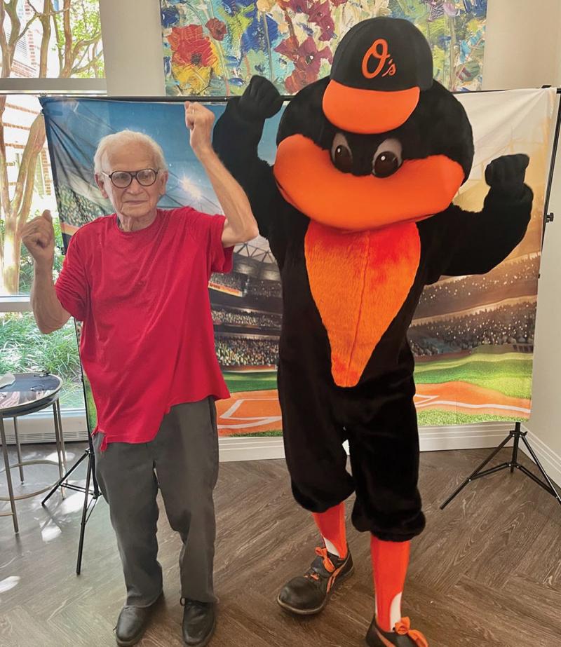 David Warzinski posing with the Orioles Bird