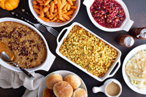 Casseroles and Thanksgiving dishes on the dinner table