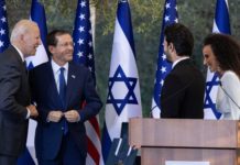 U.S. President Joe Biden and Israeli President Isaac Herzog speak with Israeli singers Yuval Dayan and Ran Dankner during a ceremony at the President’s Residence in Jerusalem, July 14, 2022.