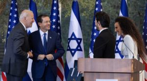 U.S. President Joe Biden and Israeli President Isaac Herzog speak with Israeli singers Yuval Dayan and Ran Dankner during a ceremony at the President’s Residence in Jerusalem, July 14, 2022. 