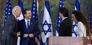 U.S. President Joe Biden and Israeli President Isaac Herzog speak with Israeli singers Yuval Dayan and Ran Dankner during a ceremony at the President’s Residence in Jerusalem, July 14, 2022.