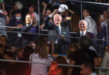 Israeli President Isaac Herzog, President Joe Biden and Israeli Prime Minister Yair Lapid applaud and cheer as they attend the opening ceremony of the Maccabiah Games at Teddy Stadium in Jerusalem on July 14.