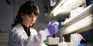 Woman in a lab coat doing medical science