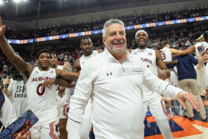 Bruce Pearl celebrates with his team after defeating the Alabama Crimson Tide at Auburn Arena, Feb. 1, 2022.