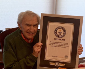 Dr. Howard Tucker holds the Guiness World Records certificate recognizing him as the oldest active physician in the United States. 
