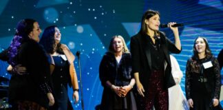 Idina Menzel sings at AMIT event