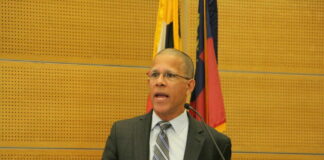 Attorney General Anthony Brown speaks at a podium