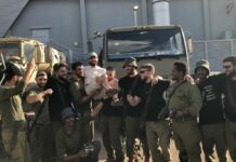 Yossi Kuttler is lifted up by friends in the IDF