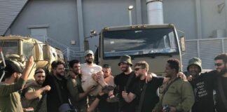 Yossi Kuttler is lifted up by friends in the IDF