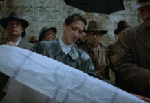 ‘The Brutalist,’ the Epic New Movie Getting Oscar Buzz, Is Built From the Stories of Postwar Jewish Architects Photo of a man looking down at a long scroll of white paper in a movie set based in Nazi Germany.