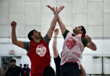 Two players jump for the opening tip at a basketball game at the University of Maryland