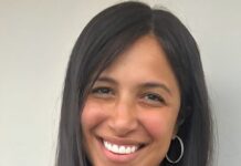 Dina Greenbaum headshot on blank background.