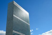 A tall, shiny building.