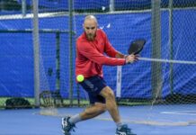 What’s the Big Dill? Pickleball Hits the Holy Land Adam Bachmann prepares to return a pickleball shot.