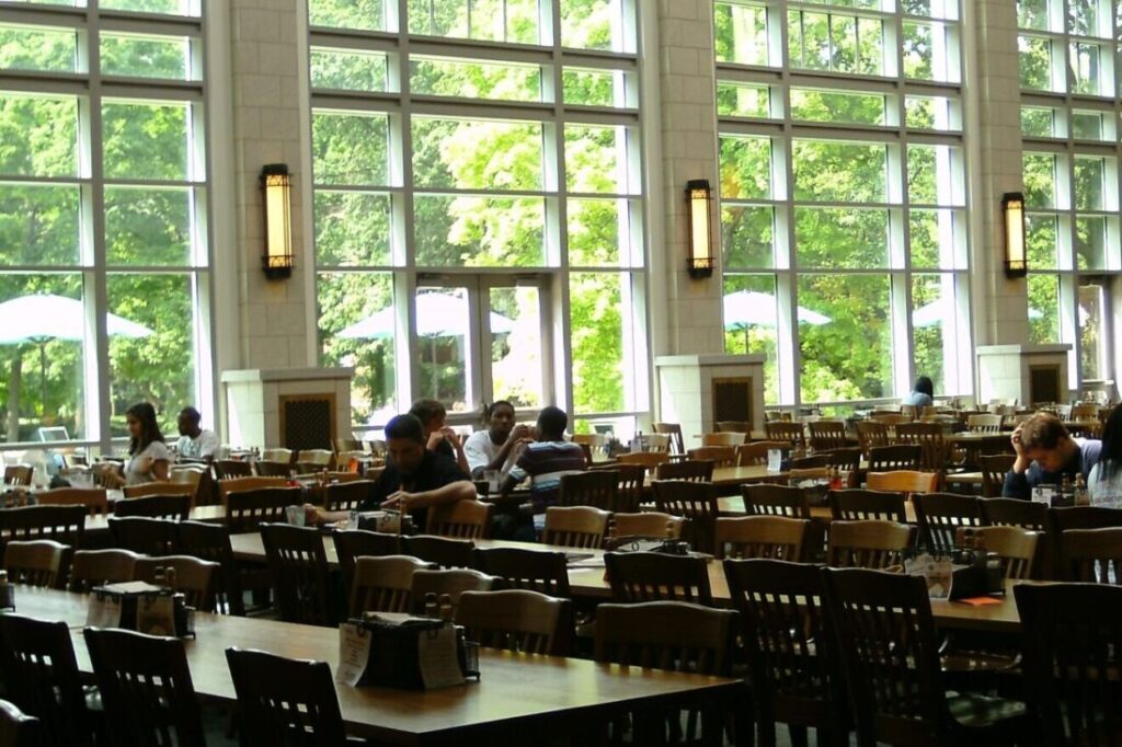A group of students sitting at tables.