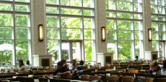 A group of students sitting at tables.