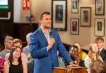 A man holding a microphone.