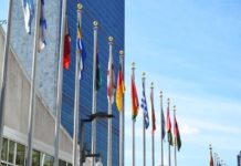 Flags in front of a building.