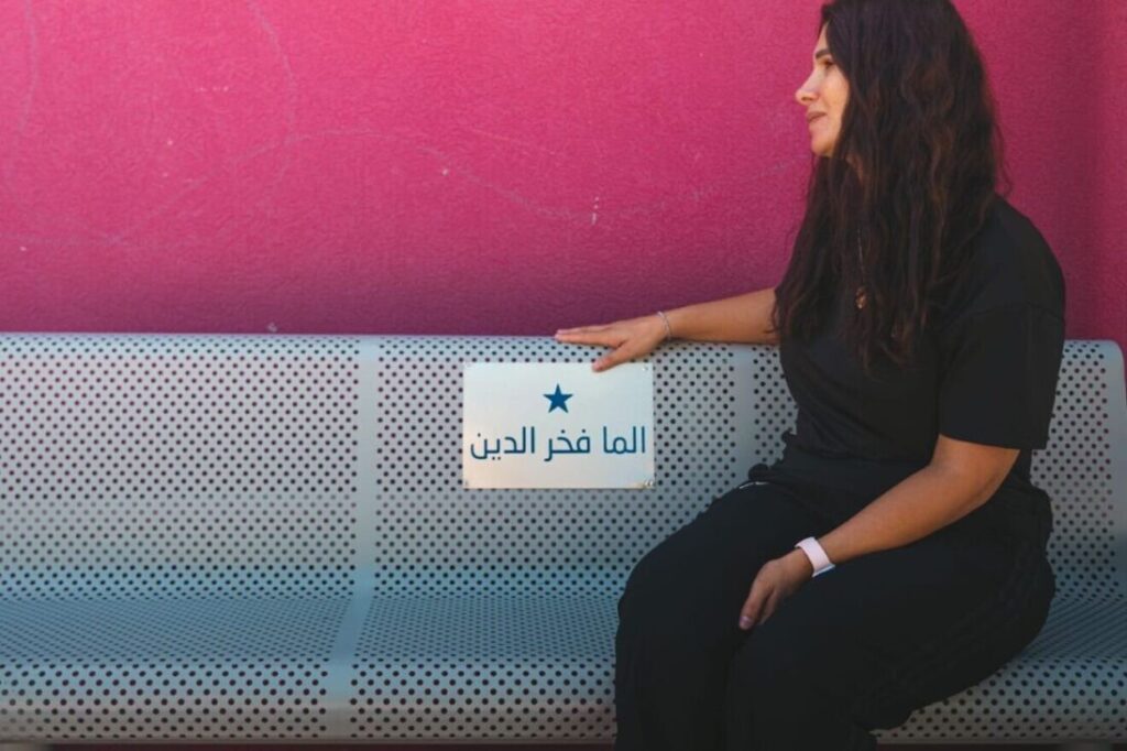 A woman sitting on a bench.