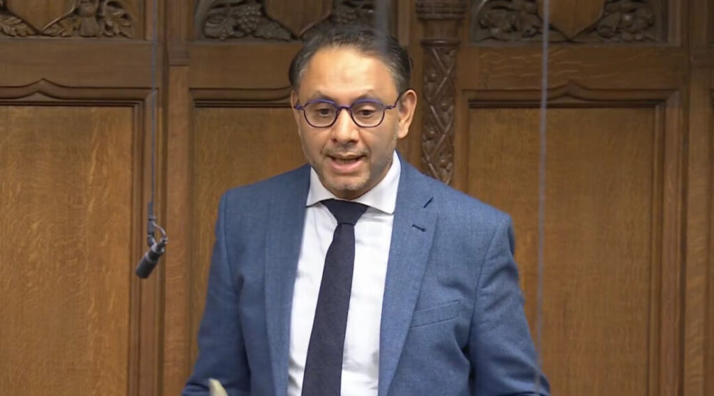 A man wearing a jacket and tie.