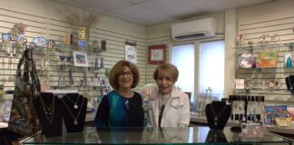 Marsye Kaplan, left, and Susan Goldscher-Belle, right, behind the counter at the Beth El Judaica Shop.
