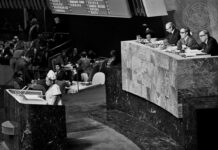 Opinion: 50 Years Ago, With One Vote, the UN Set in Motion Today’s Anti-Zionism A black and white photo of the inside of the United Nations.