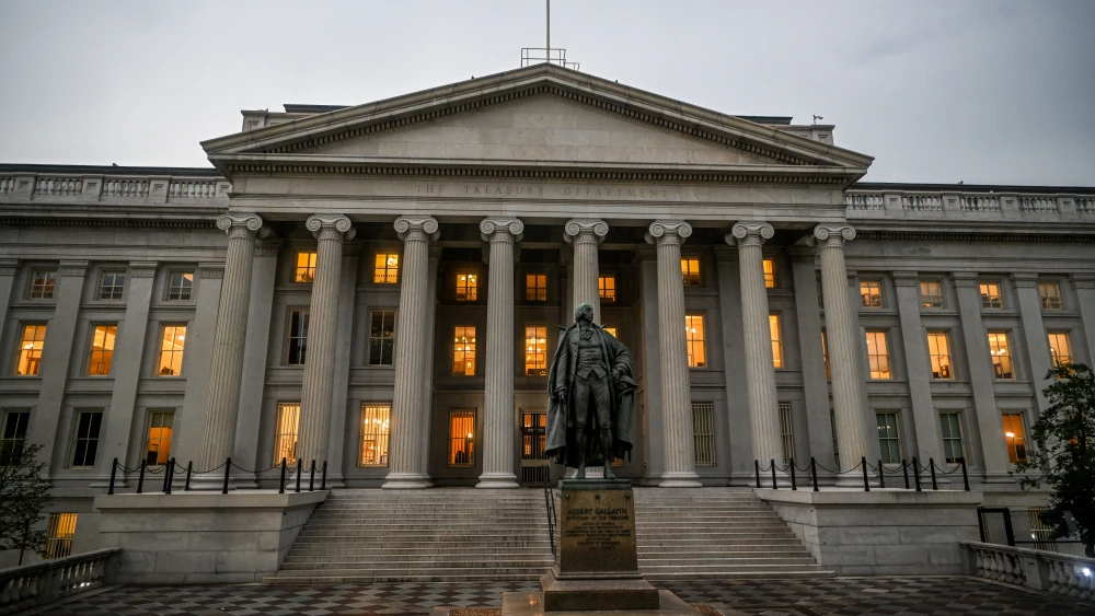 A large, gray building with pillars.