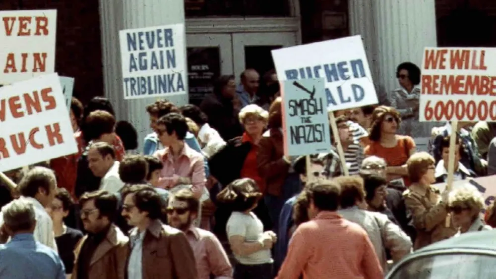 Protesters, many of them Jewish and many holding signs that harken back to the Holocaust, gather for an anti-neo-Nazi demonstration in front of Skokie Village Hall outside Chicago in May 1977.