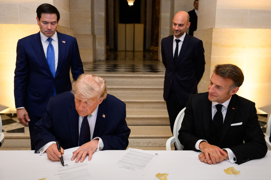 President Donald Trump signs a memorandum of understanding between Iran and the United States at the Palace of Versailles, France, on June 17, 2026.