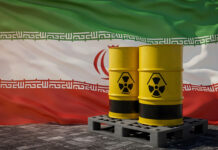 Nuclear waste containers against the Iranian flag