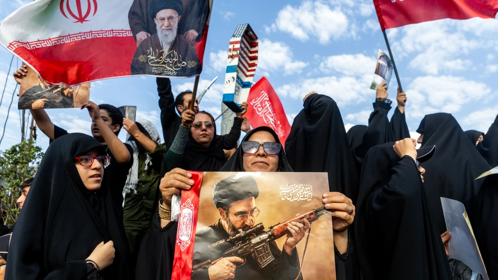 Mourners display images of Iran’s slain Supreme Leader Ayatollah Ali Khamenei and his son and successor, Mojtaba Khamenei, during the third day of the elder Khamenei’s funeral ceremonies in Tehran, Iran, on July 6, 2026.