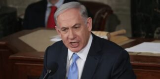 Israeli Prime Minister Benjamin Netanyahu urges lawmakers to reject the Iran nuclear deal during a joint meeting of Congress in the House chamber at the U.S. Capitol, March 3, 2015.