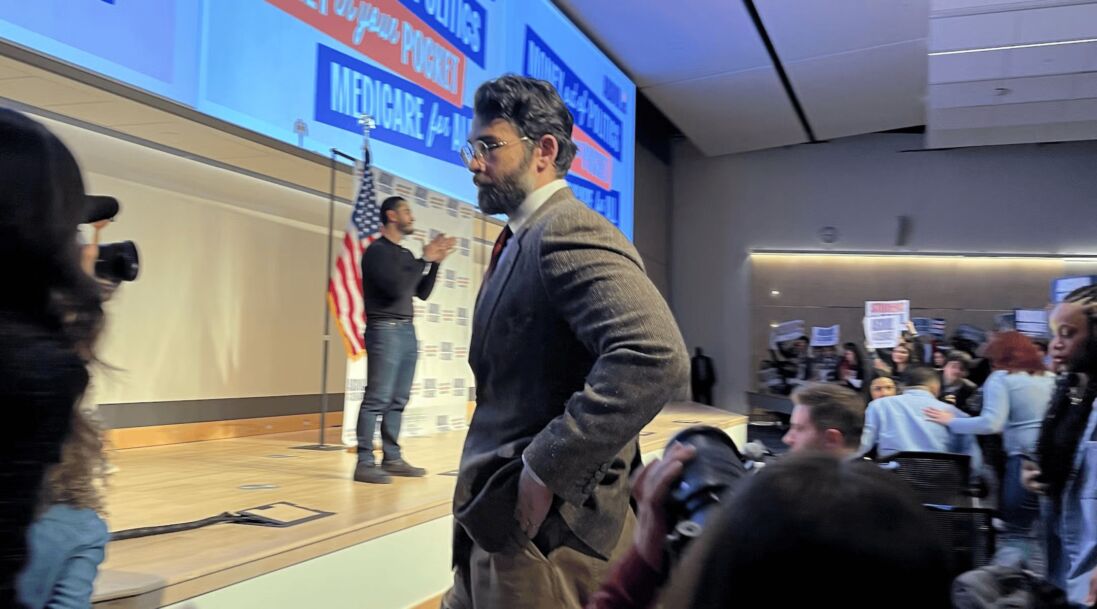 Hasan Piker looks on as U.S. Senate candidate Abdul El-Sayed delivers a stump speech in Ann Arbor, Michigan, April 7, 2026. Piker, a popular Twitch streamer accused of antisemitism, prompted controversy for campaigning with El-Sayed.