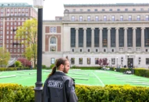 A security officer stands guard at a nearly empty Columbia University campus after police cleared out a Gaza protest tent encampment in New York City on May 6, 2024.