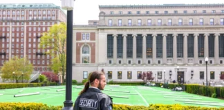 A security officer stands guard at a nearly empty Columbia University campus after police cleared out a Gaza protest tent encampment in New York City on May 6, 2024.